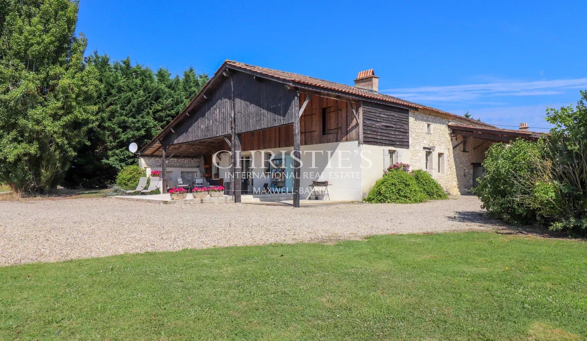 Stunning Farmhouse Estate with Charming Guardian Cottage, Inviting Pool, Tennis Court, and Sprawling 64 Acres of Land