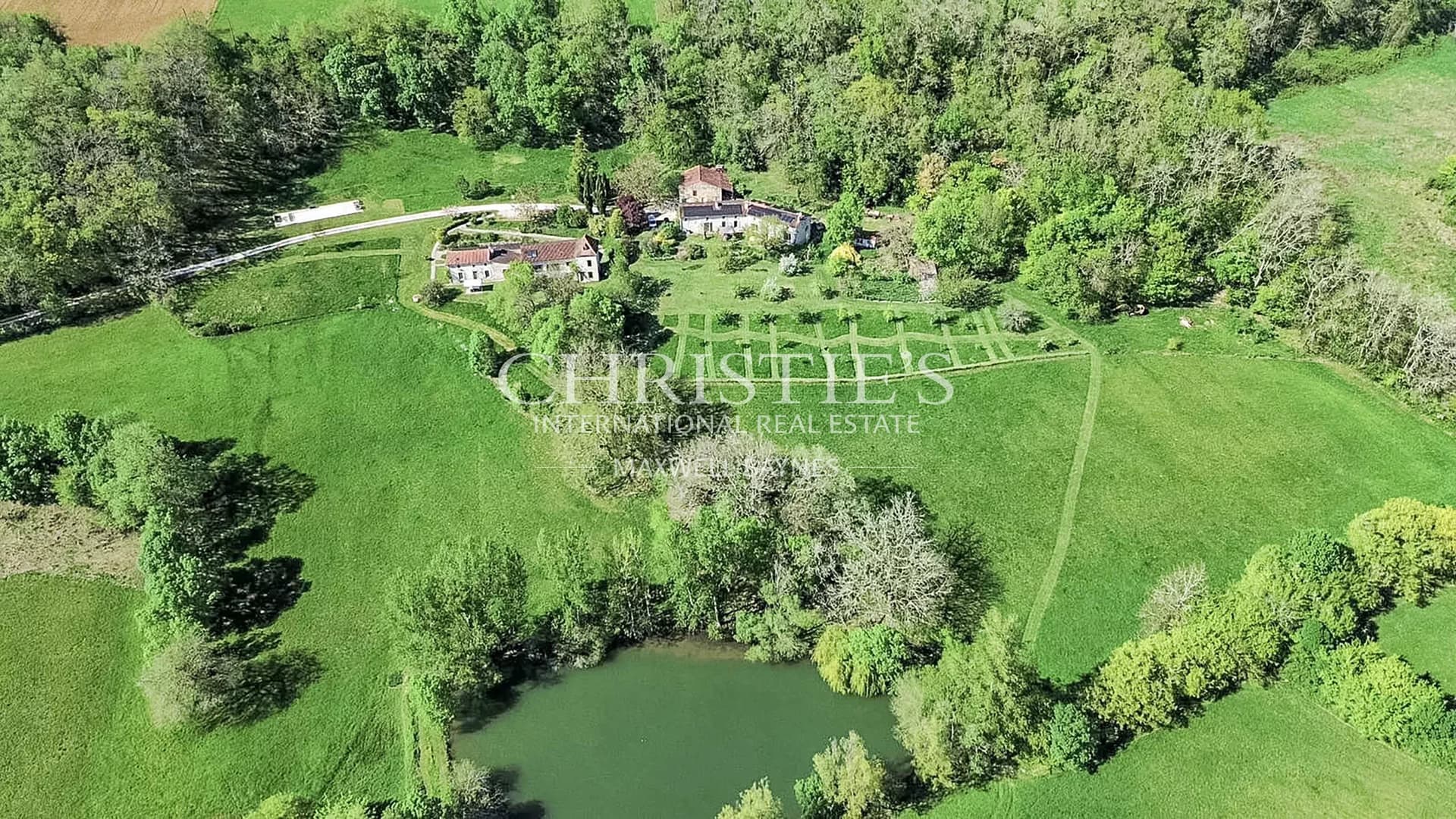 Country estate featuring three houses, a picturesque lake, and 45 acres of rolling land