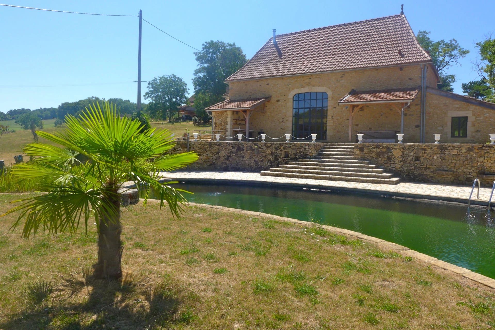 Beautiful open plan stone barn conversion with two traditional stone guest houses and natural pool